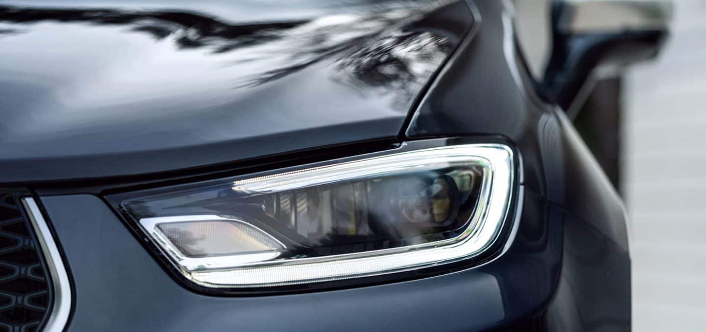 Display A close-up of an LED headlamp on a 2024 Chrysler Pacifica Pinnacle
