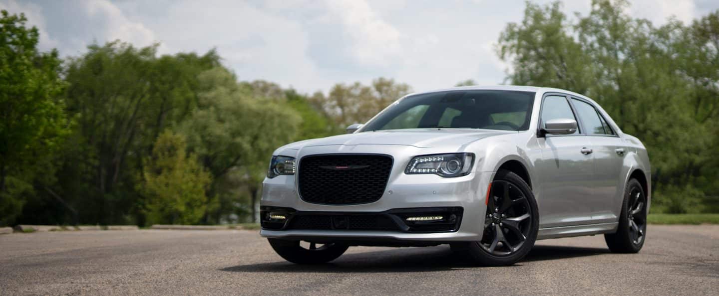 An angled driver-side profile of a silver 2023 Chrysler 300S.