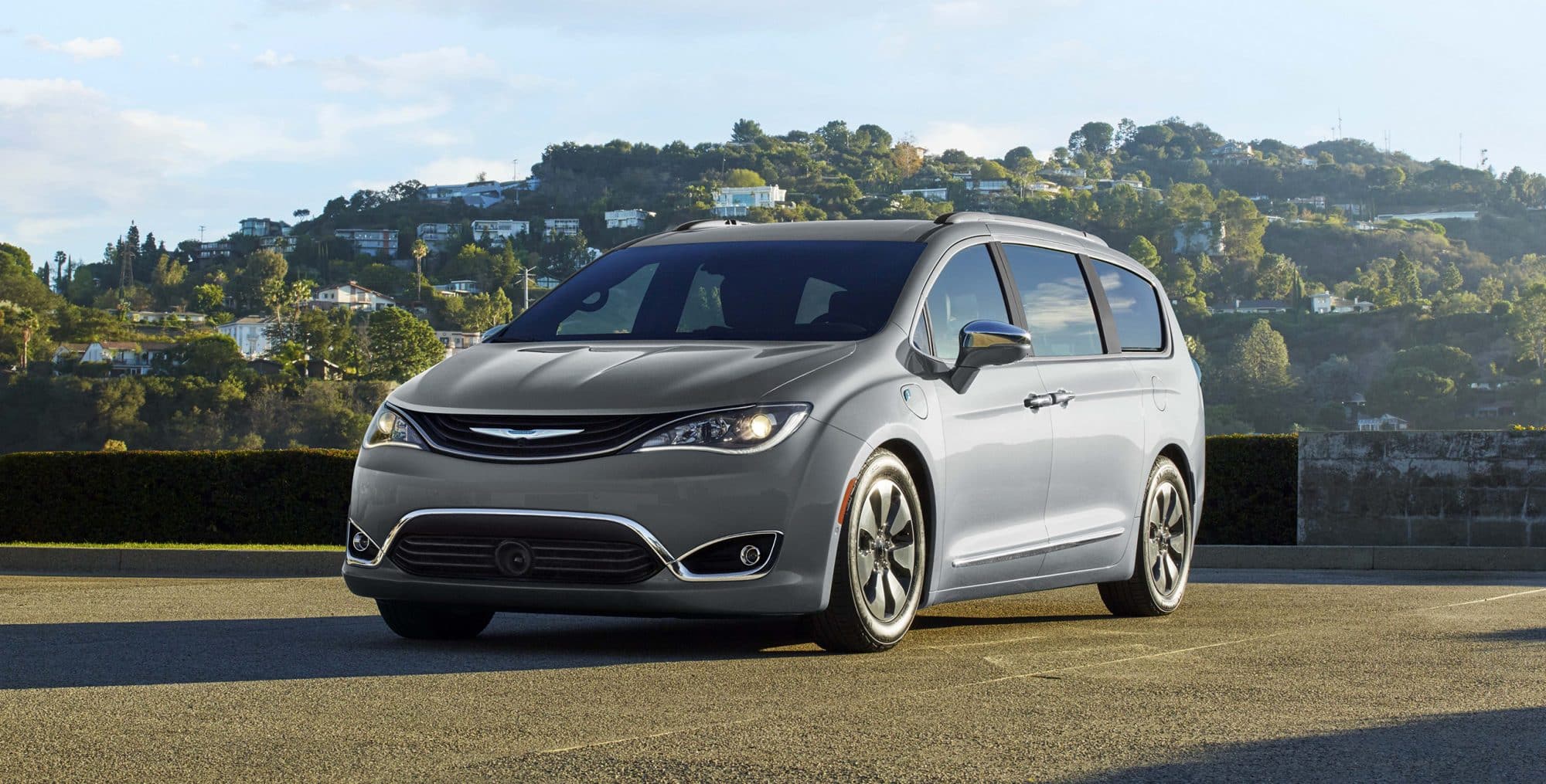 Gray 2018 Chrysler Pacifica with mountain homes in background