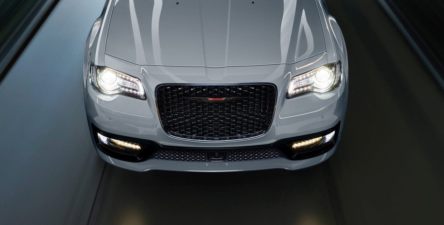 Display A view from above of the hood, grille and headlamps on the 2021 Chrysler 300S V8 in Silver Mist, with the S Model Appearance Package.
