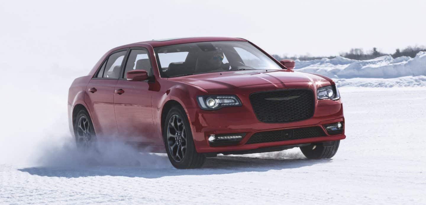 Display The 2023 Chrysler 300 being driven on snow.