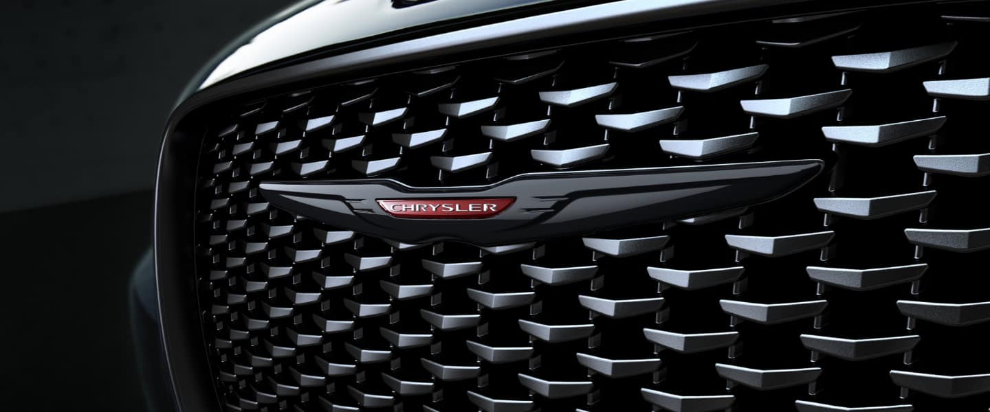 A close-up of the front grille and Chrysler badge on the 2023 Chrysler 300.