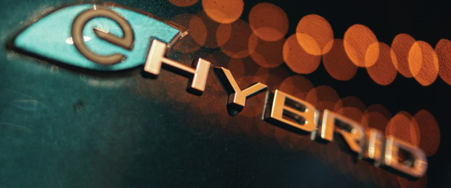 A close-up of the "e" badge on the 2023 Chrysler Pacifica Hybrid.