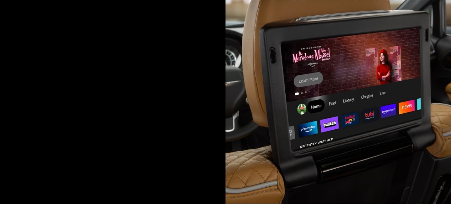 A close-up of the seatback-mounted touchscreen in the 2023 Chrysler Pacifica Pinnacle Hybrid displaying a choice of streaming apps and channels.