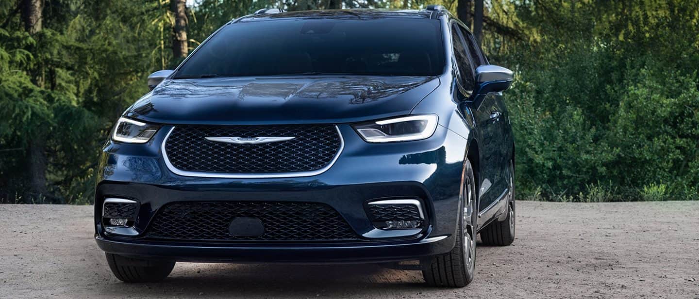 Display A front angle of a blue 2024 Chrysler Pacifica Pinnacle Plug-In Hybrid.