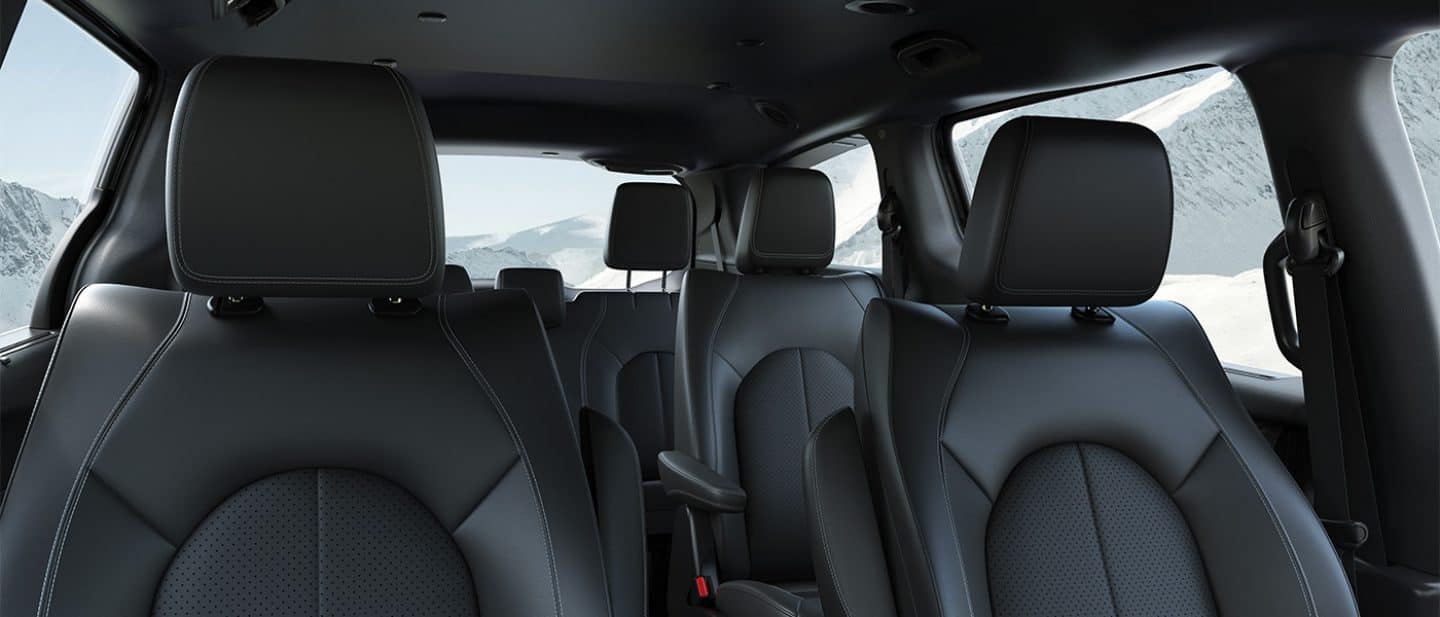 Display The three rows of seats in the 2025 Chrysler Voyager LX, from the front, to the rear.