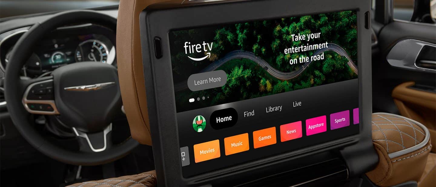 Display One of the two seatback-mounted touchscreens in the second row of the 2026 Chrysler Pacifica Pinnacle, displaying selections from Amazon FireTV.