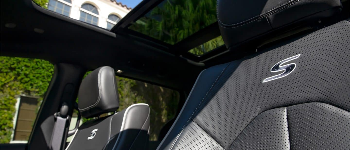 Display The front seats with "S" embroidered on them, just below the headrests in the 2026 Chrysler Pacifica Plug-in Hybrid Select with the Premium S Appearance Package.