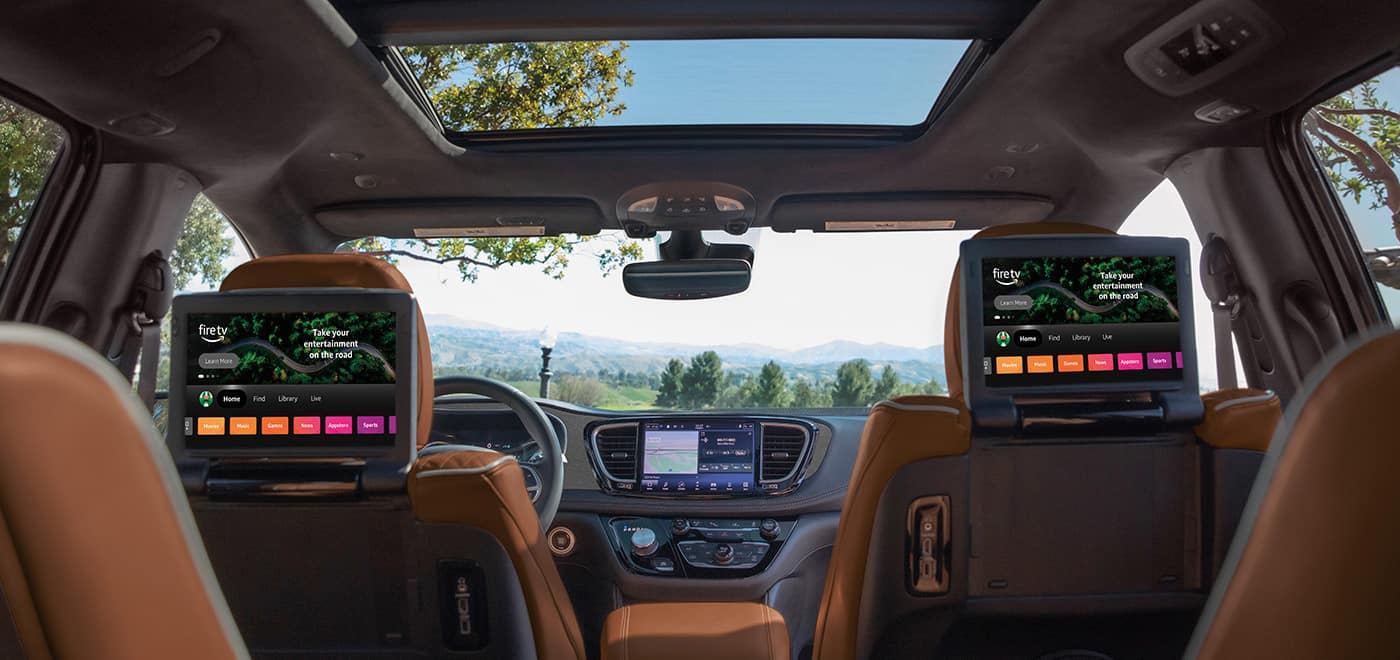 Chrysler Pacifica interior with rear-seat entertainment screens and a panoramic roof