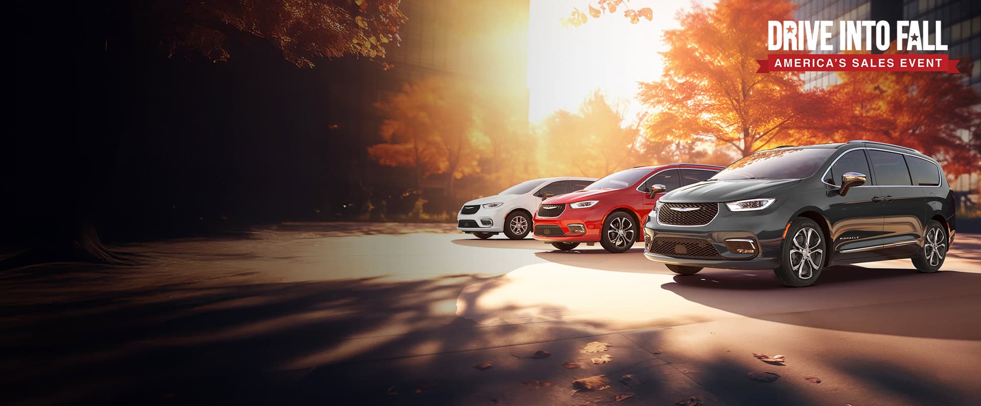 Three 2026 Chrysler minivan models parked on an oceanside beach. From left to right: a white Chrysler Voyager, a blue Pacifica Pinnacle Plug-in Hybrid and a red Pacifica Pinnacle. Drive into fall. America's sales event
