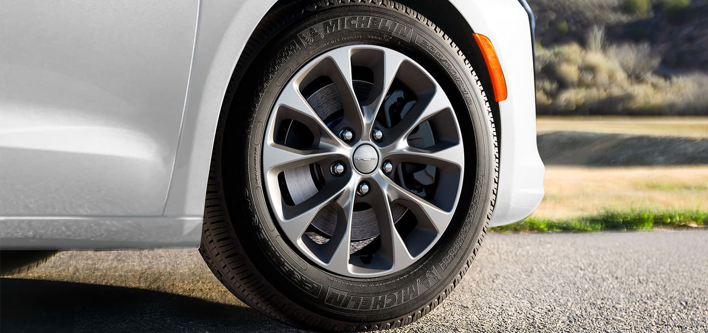 A wheel on a white 2027 Chrysler Pacifica.