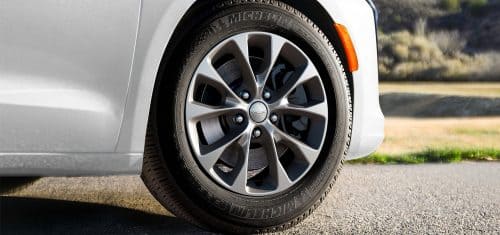 A wheel on a white 2027 Chrysler Pacifica.