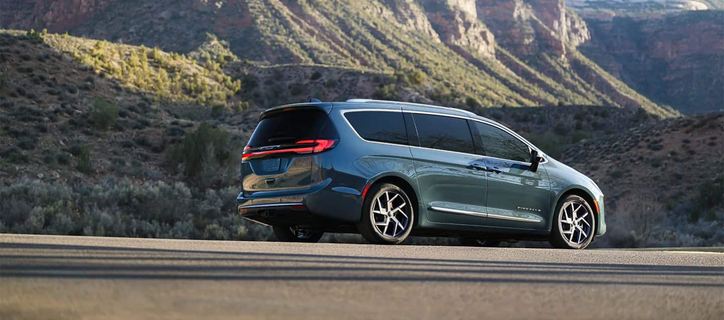 Display A rear view of a blue Pacifica Pinnacle in a parking lot.