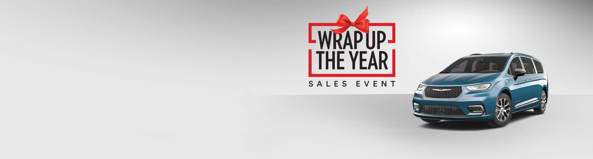 A blue Chrysler Pacifica Pinnacle Plug-in Hybrid. Wrap up the year Sales Event logo.