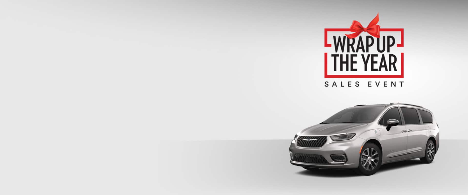 A front driver-side angle of a gray 2025 Chrysler Pacifica Hybrid Pinnacle model. Wrap Up the Year Sales Event.