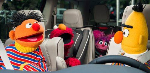  Sesame Street muppets inside of a Chrysler Pacifica.