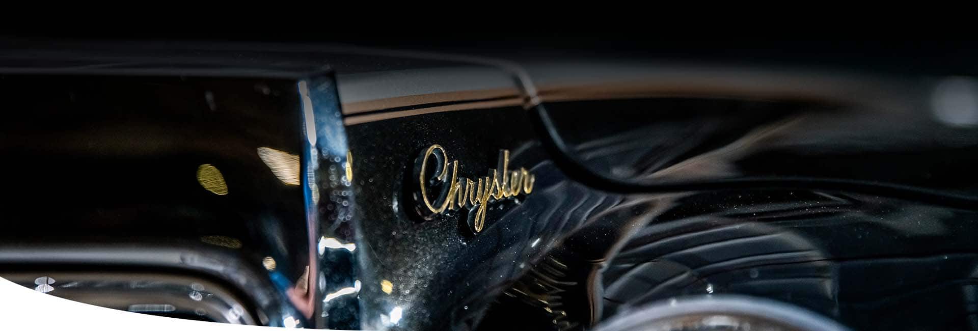 The Chrysler badge on a vintage Chrysler Brand vehicle.