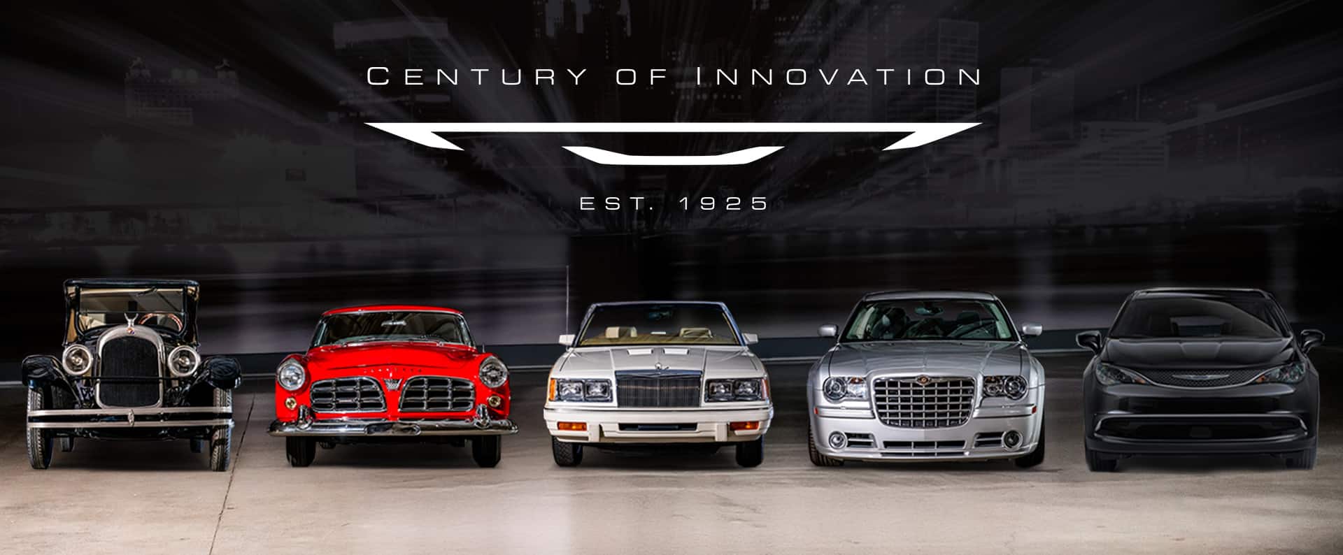 A head-on angle of five Chrysler Brand vehicles from over the past 100 years parked in a row. Century of Innovation established 1925.