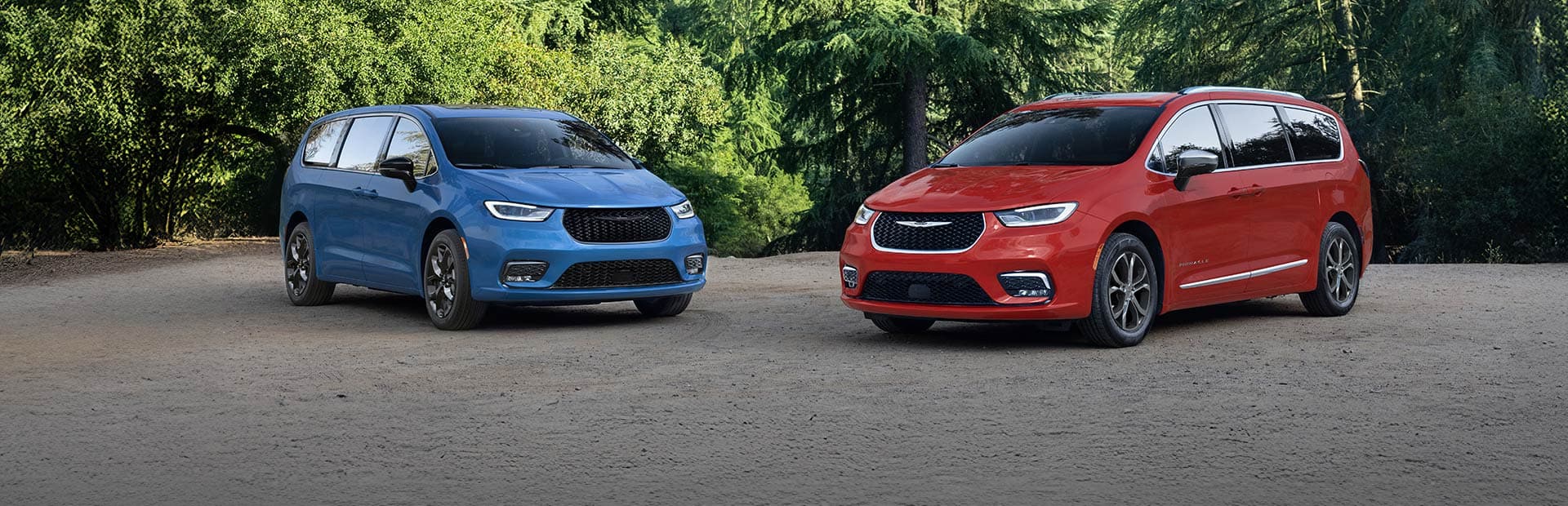 A blue 2026 Chrysler Pacifica Limited with the S Appearance Package and a red 2026 Chrysler Pacifica Pinnacle parked perpendicular to each other.