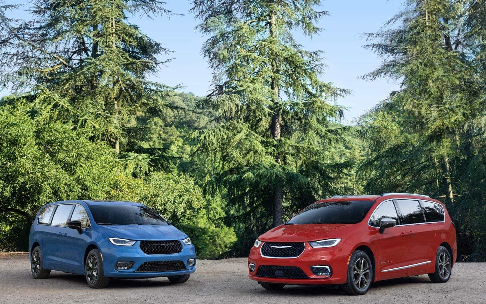 A blue 2026 Chrysler Pacifica Limited with the S Appearance Package and a red 2026 Chrysler Pacifica Pinnacle parked perpendicular to each other.